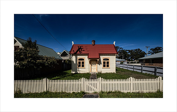 ABANDONED POLICE STATION WITH WHITE PICKET FENCE